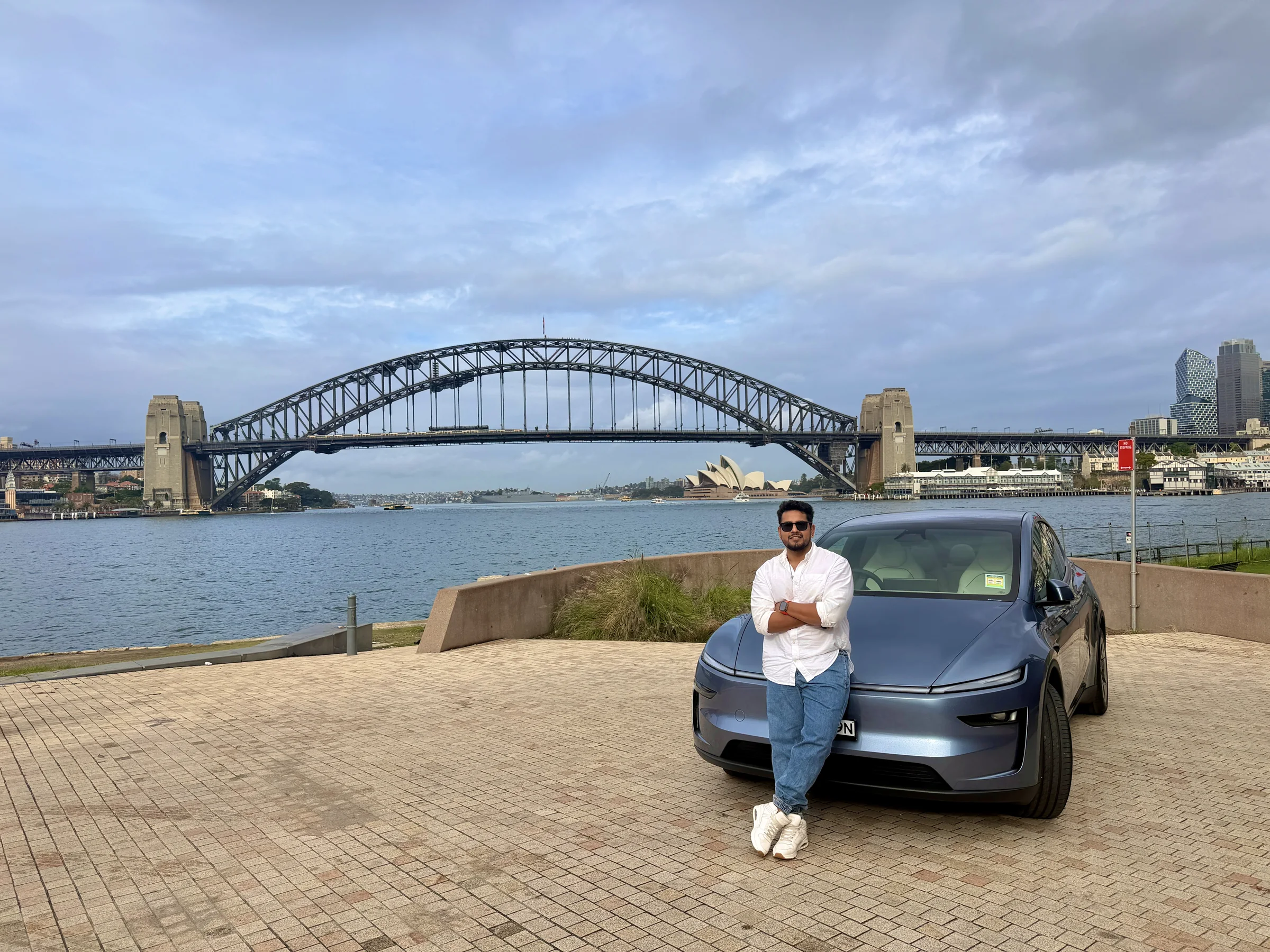 The ABMods founder with a Model Y at Sydney Harbour
